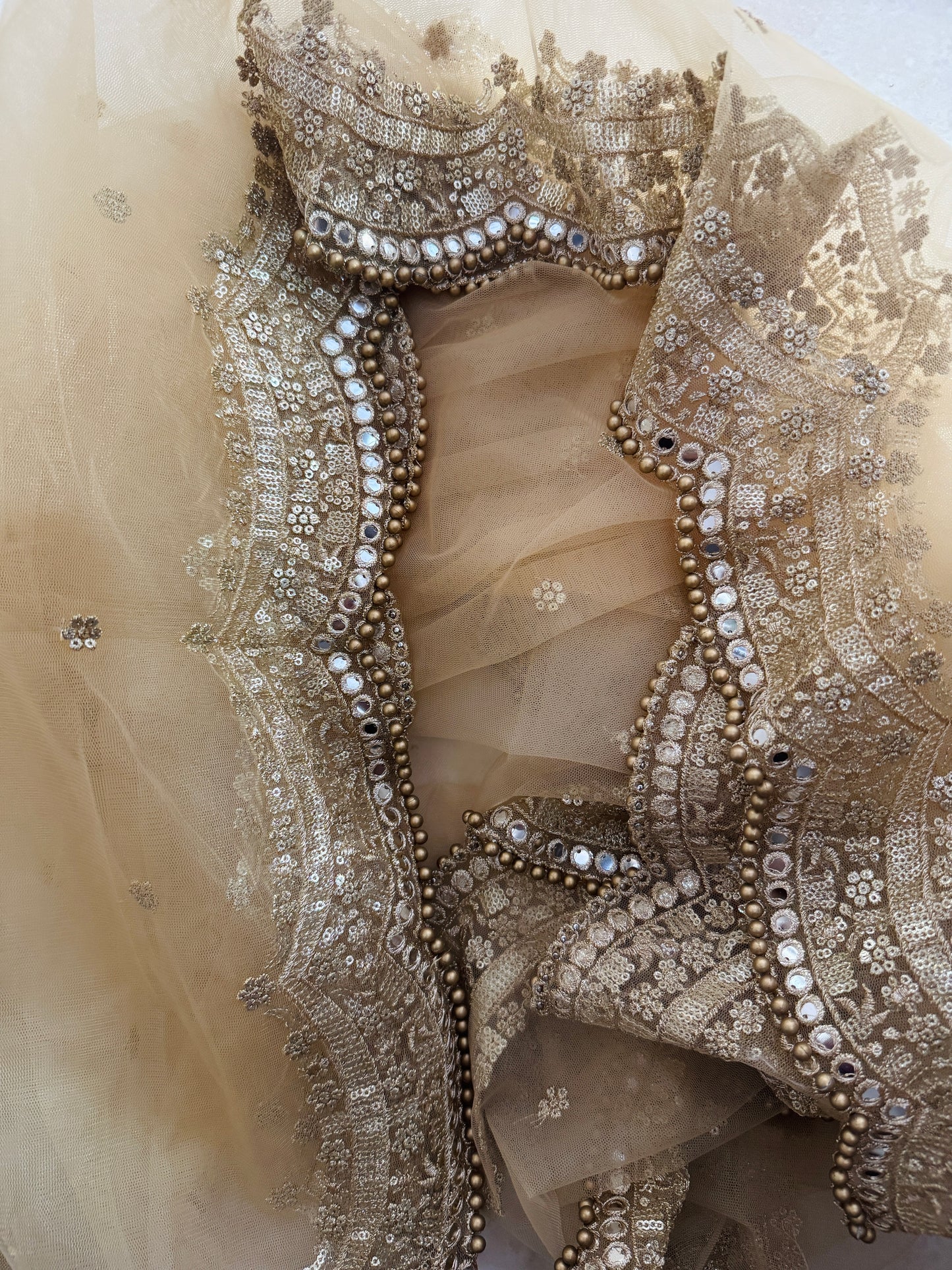 Bridal dupatta in golden net fabric with heavy zari border